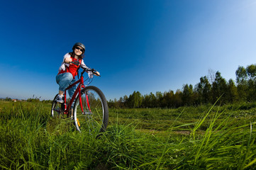 Fototapeta na wymiar Girl riding bike