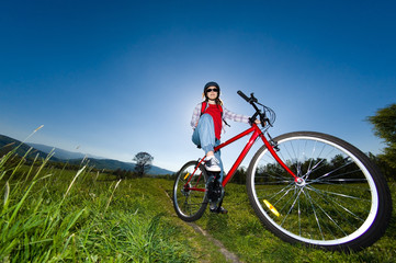 Fototapeta na wymiar Girl riding bike