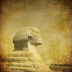 grunge image of sphynx and pyramid