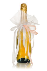 Corked bottle of champagne with wedding decoration