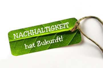 Nachhaltigkeit Slogan - auf natürlichem Kartonschild