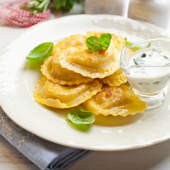 Panzerotti with blue cheese sauce and spinach