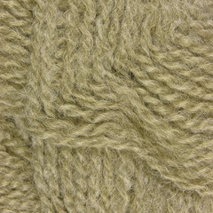 Natural beige fine wool threads texture clew macro closeup