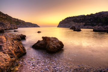 Fototapeta na wymiar Wschód słońca w Grecji. Fotografia HDR Anthony Quinn Bay.
