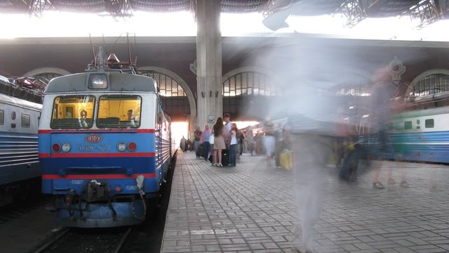 People pass on platform in Rail Terminal