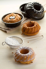 Three fresh cupcake with raisins