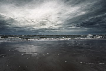 Stormy sky over sandy shore