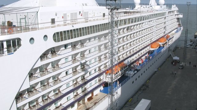 cruise liner stationed at bay, top-down view, time lapse