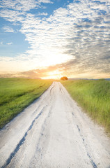 Road on greeen meadow