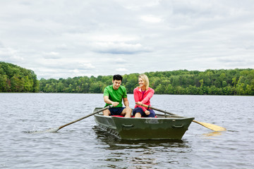 Couple in a rowboat on a lake