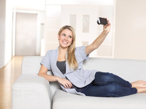 young woman taking picture of herself