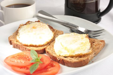 Eggs on toast with coffee