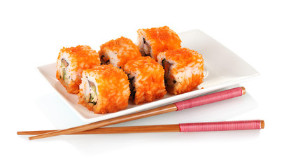 delicious sushi on plate and chopsticks isolated on white
