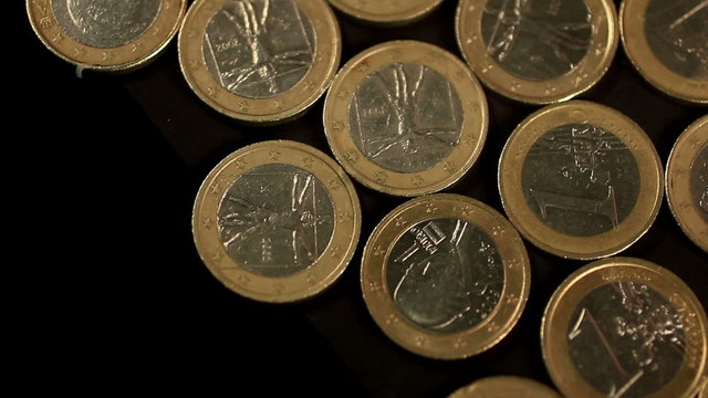 Heap of euro coins falling to the ground