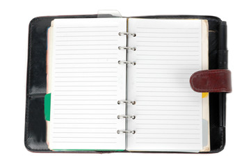 an opened brown leather notebook