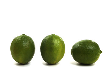 Three limes on white background
