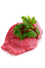 Cut of  beef steak with green leaf. Isolated.