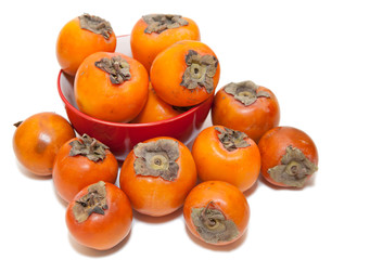 Red juicy persimmons isolated on white background