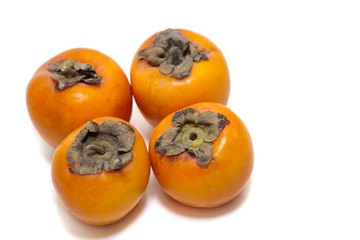 Red juicy persimmons isolated on white background