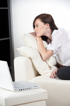 Young woman worried with laptop