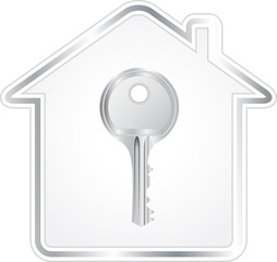 beautiful silver key in metallic house silhouette