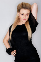 Fototapeta premium Beautiful young female in black dress