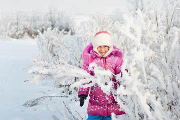 A girl walks in winter