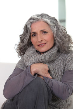 Portrait of a woman wearing  gray clothing