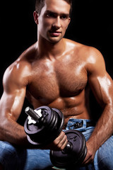 Fototapeta Fitness - powerful muscular man lifting weights obraz