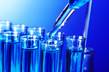 Test-tubes on blue background