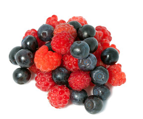berries of raspberry and bilberry on white background