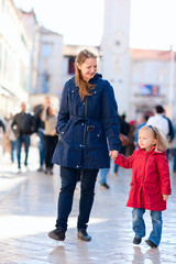 Mother and daughter in city