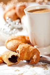 Christmas cake with plum jam and a mug of coffee