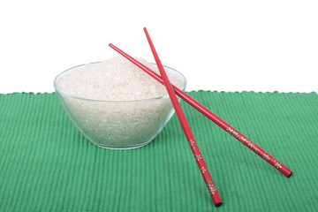 Rice in glass dish and Red chopsticks, on green tablecloths