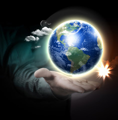 Human hand holding earth
