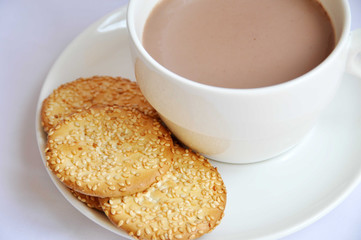 biscuit with cup of coffee and cream