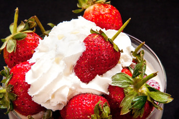 Close-up of strawberries in cream