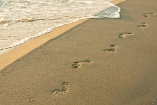 Fußspuren am Strand