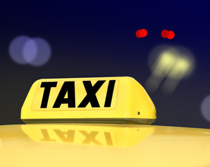Taxi sign at night
