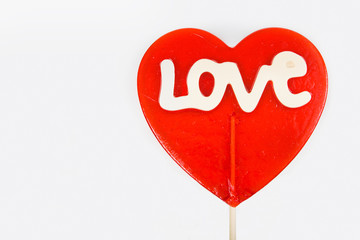 Love lollipop on a white background