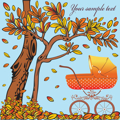 Baby carriage in the autumn background. Autumn theme.