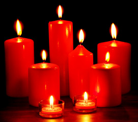 Group of  candles on  black background.
