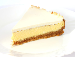 Layered cheesecake case on white plate
