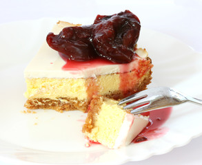 Layered cheesecake case on white plate