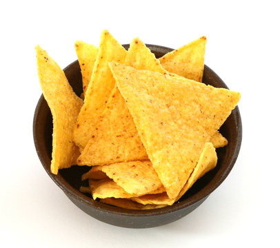 Mexican tortilla chips in brown bowl on white background
