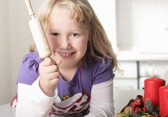 A little girl baking for Christmas