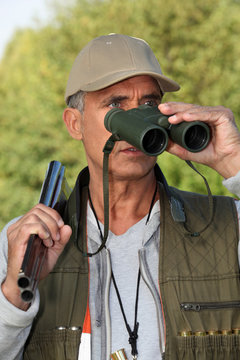 Hunter Looking Through Binoculars