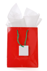 Red gift bag with blank tag isolated on white
