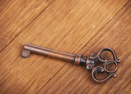 Key from an old case on a wooden surface