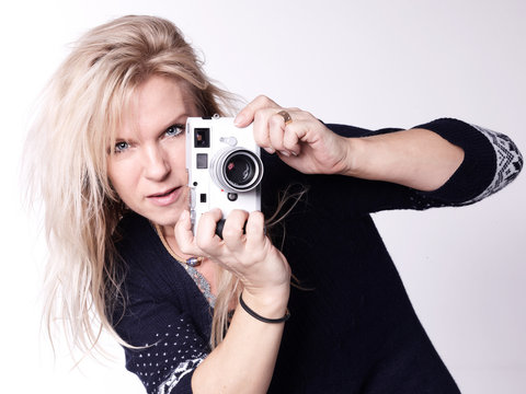 Pretty photographer takes photos with her new camera